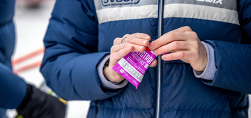 winter jacket athlete opening mixed berry fastchews packet