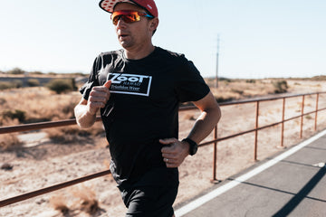 Ben Hoffman running on road during training