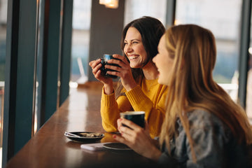 People smiling in a coffee shop