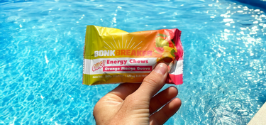 Bonk Breaker OMG Chews in front of a pool