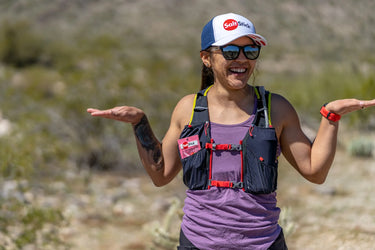 A runner with a packet of SaltStick Watermelon FastChews electrolytes in her pocket