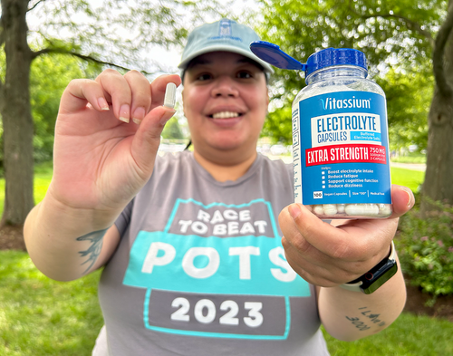 Person holding a 100ct bottle of Vitassium Extra Strength Capsules.